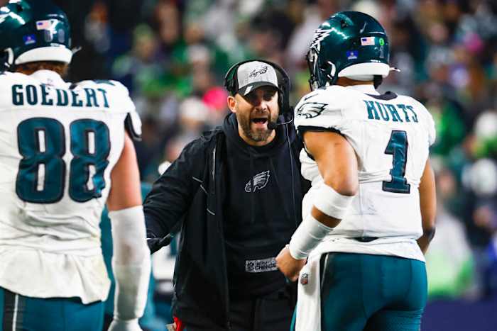 Philadelphia Eagles head coach Nick Sirianni greets quarterback Jalen Hurts following a touchdown against the Seattle Seahawks during the third quarter at Lumen Field.